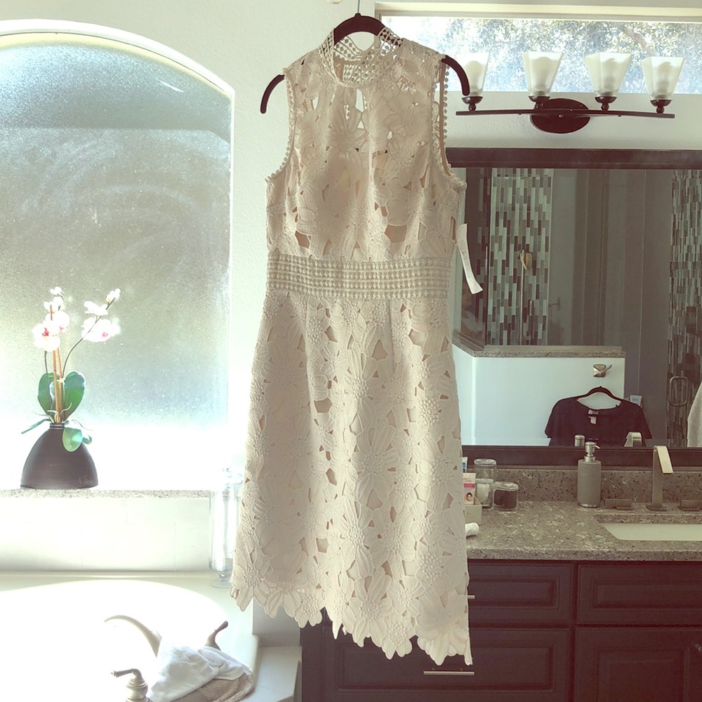 Beautiful, never worn, peek a boo back dress